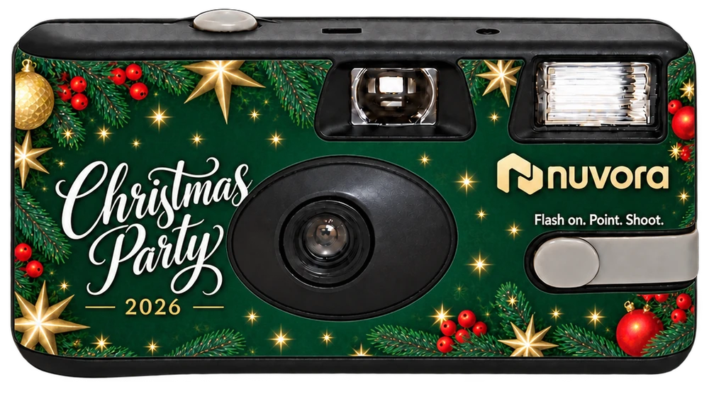 A disposable camera with a deep green Christmas Party 2026 sticker with gold stars, baubles, holly and a company logo