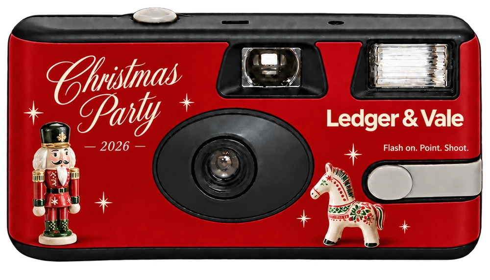 Front of a disposable camera: a red Christmas Party 2026 sticker with a nutcracker, a painted wooden horse and a company logo