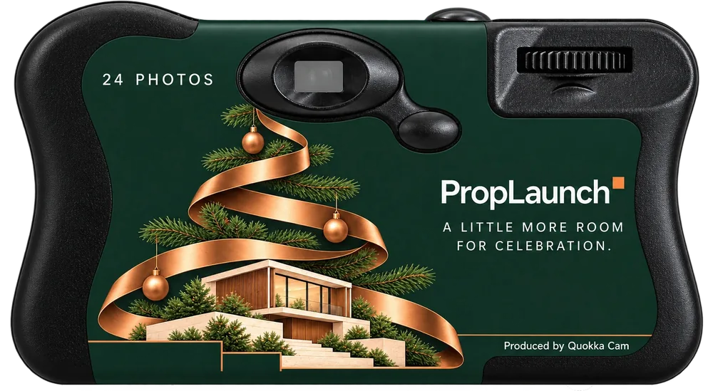 Back of the same camera: a copper ribbon Christmas tree over a modern house, the PropLaunch line A little more room for celebration, and a small Produced by Quokka Cam line